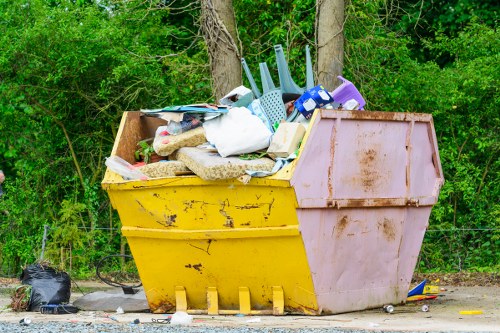 Construction site with builders clearing waste