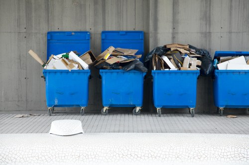 Waste crew setting up recycling bins outside Plaistow business premises